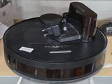 a black and silver vacuum on a shelf in a room