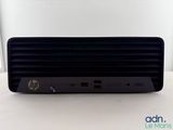 the hp desktop computer is sitting on top of a white table