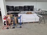 a lot of boxes and a cart in a warehouse