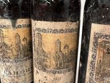 three bottles of wine sitting next to each other on a table