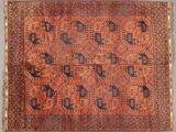 an antique persian rug with geometric design on a blue ground