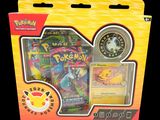 a box of pokemon cards and a coin in it