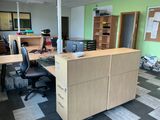 an image of an office with desks and chairs