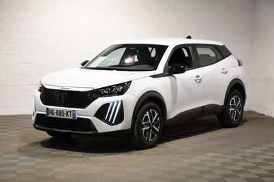 the white suv is parked in a large room with checkered flooring