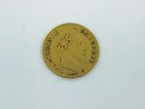 a gold coin with a picture of a woman on it