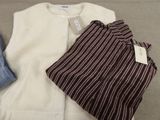 a white shirt and a brown and white striped shirt and a blue and white striped shirt