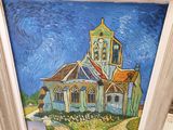 une photo d'un tableau représentant une église, dans un cadre