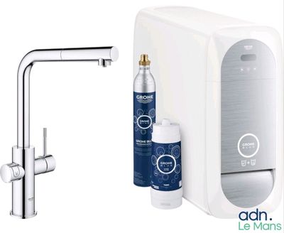 a water dispenser and a bottle of water next to a faucet