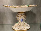 a glass display case with a bowl on top of it