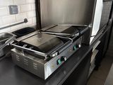 a stove that is sitting on a counter in a kitchen
