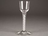 a wine glass that is sitting on a table