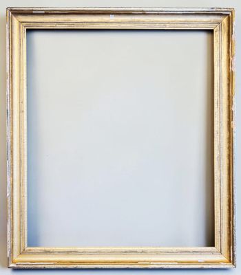 an empty picture frame hanging on a wall with a white background