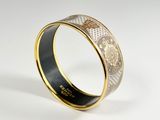 a close up of a ring on a white surface