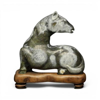sculpture of a horse on a wooden base on a white background