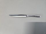 a knife that is laying on top of a table
