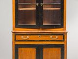 an antique wooden cabinet with two doors and two drawers