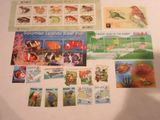 a collection of stamps and postcards on a table