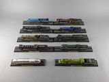 a lot of toy trains that are sitting on a table