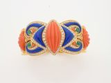 a close up of an orange, blue and green bracelet on a white surface