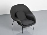 a black chair that is sitting in a room