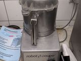 a silver blender sitting on a counter in a kitchen