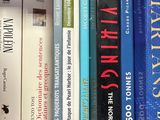 many books that are on a shelf in the room