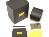a black box with a watch and other items in it