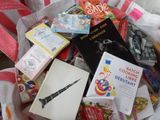 a basket full of books and books on a table