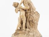 an image of a statue of a woman holding a child
