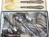 silverware in a box with spoons, forks and spoons in it