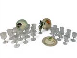 a lot of glassware sitting on a table