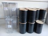 a stack of black barrels sitting on a counter