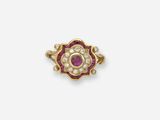 une broche-bague sertie de rubis et de diamants