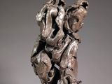 statue of a man holding a dog on his back