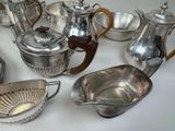 a lot of silver items that are on a table