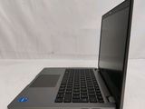 an open laptop computer sitting on top of a white surface