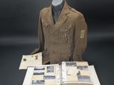 an old military jacket and a book are sitting on a table