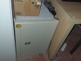 a box that is sitting on top of a filing cabinet