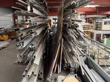 a large pile of metal beams in a warehouse