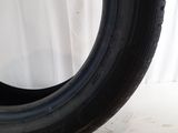 a close up of a tire on a white surface with a white background