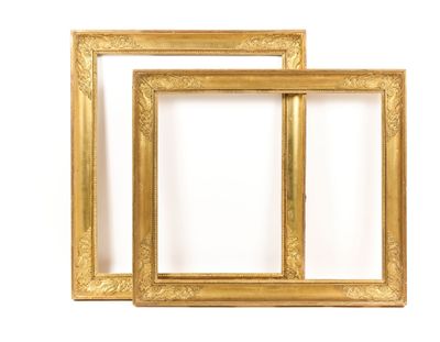 two gold picture frames on a white background