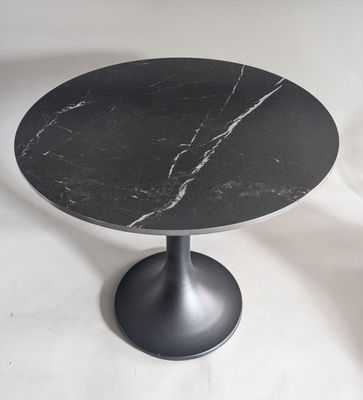 black marble table with a black pedestal on a white background