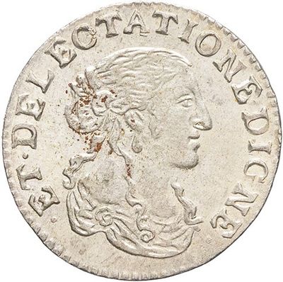 a silver coin with a woman ' s head on it