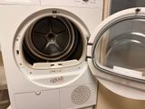 a washer and dryer sitting next to each other in a room