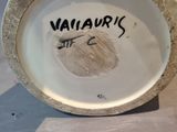 a close up of a vase with writing on it