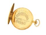 a gold pocket watch with a gold case on it
