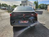 a car that is spraying water out of the back of it