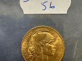 a close up of a gold coin with a label on it