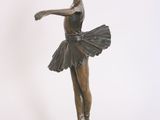 bronze statue of a young ballerina in a tutu