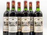 six bottles of red wine are lined up in a row
